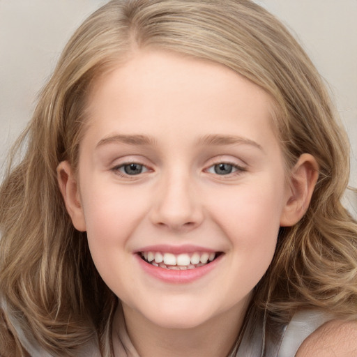 Joyful white child female with medium  brown hair and grey eyes