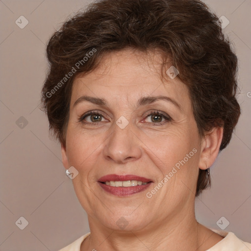 Joyful white adult female with short  brown hair and brown eyes