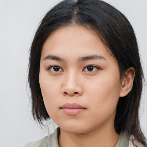 Neutral asian young-adult female with medium  brown hair and brown eyes
