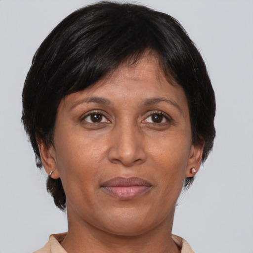 Joyful asian adult female with short  brown hair and brown eyes
