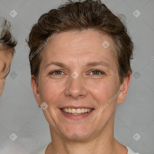 Joyful white adult female with short  brown hair and brown eyes