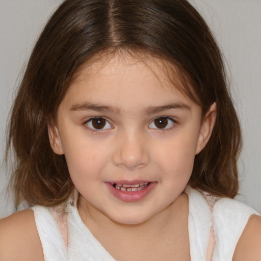 Joyful white child female with medium  brown hair and brown eyes