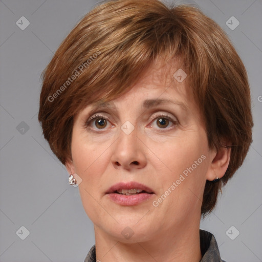 Joyful white adult female with medium  brown hair and grey eyes