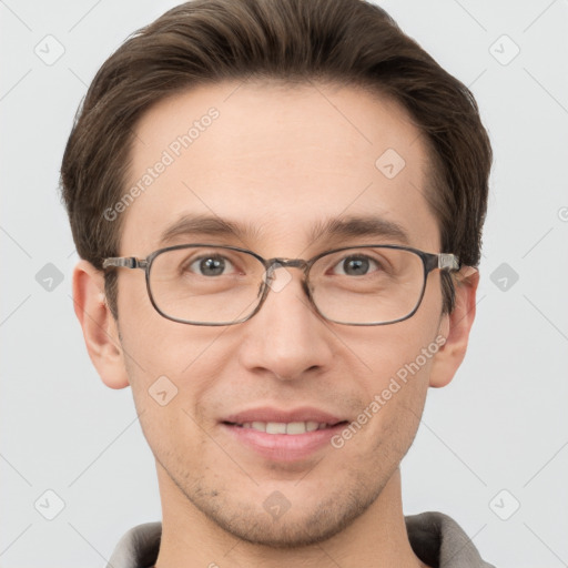 Joyful white adult male with short  brown hair and grey eyes