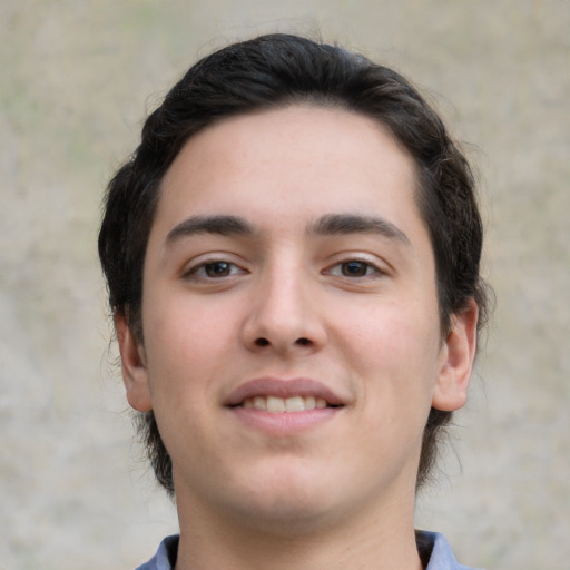 Joyful white young-adult male with medium  brown hair and brown eyes