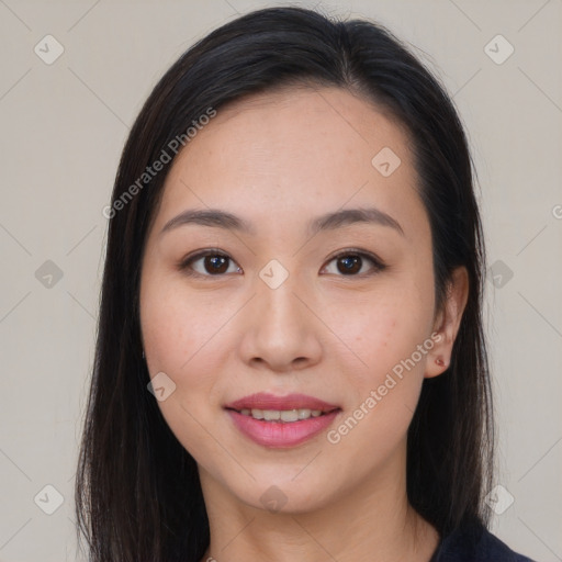 Joyful asian young-adult female with long  brown hair and brown eyes