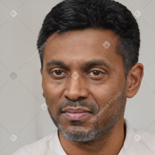 Neutral latino adult male with short  black hair and brown eyes