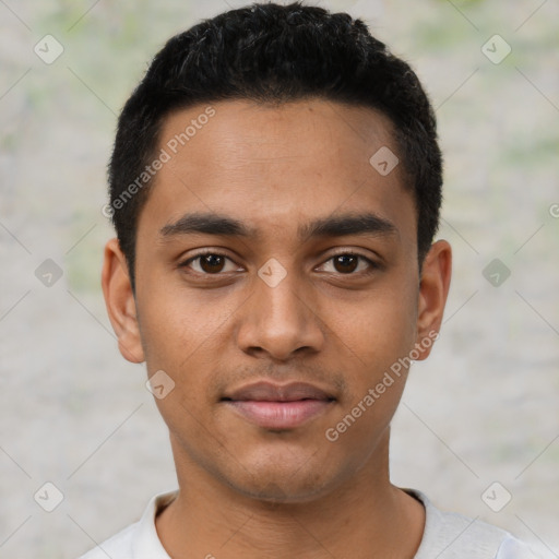 Joyful latino young-adult male with short  black hair and brown eyes