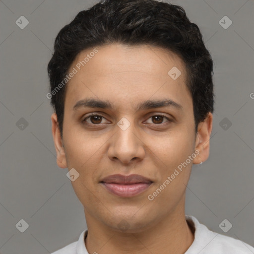 Joyful latino young-adult male with short  brown hair and brown eyes