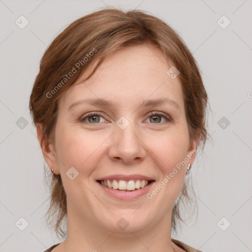 Joyful white young-adult female with medium  brown hair and blue eyes