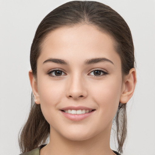 Joyful white young-adult female with medium  brown hair and brown eyes