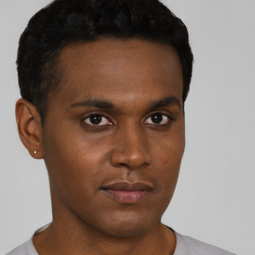 Neutral black young-adult male with short  black hair and brown eyes
