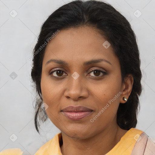 Joyful black young-adult female with short  brown hair and brown eyes