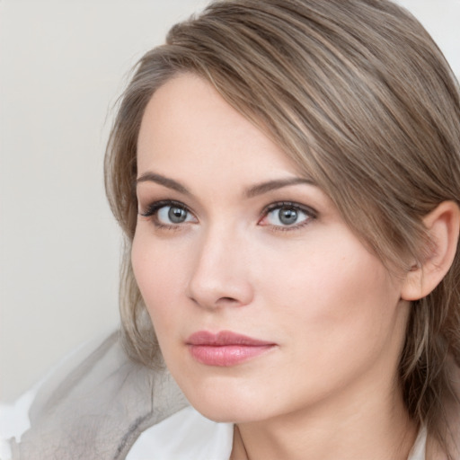 Neutral white young-adult female with medium  brown hair and grey eyes