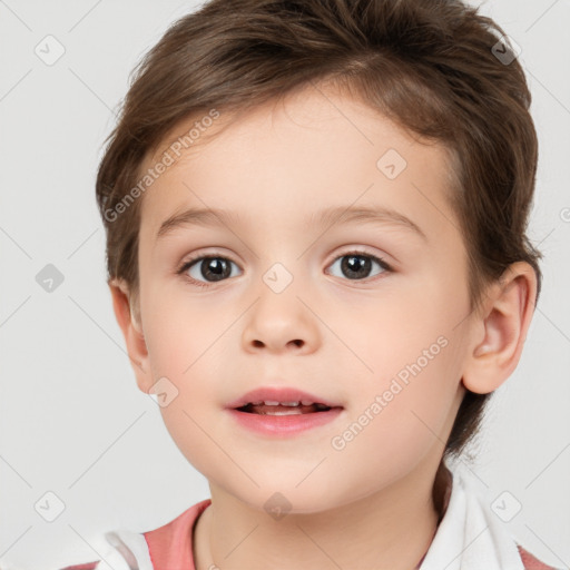 Joyful white child female with short  brown hair and brown eyes