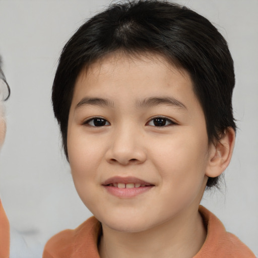 Joyful asian child female with medium  brown hair and brown eyes