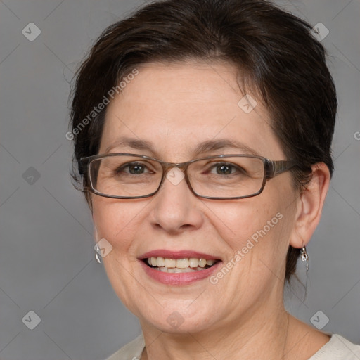 Joyful white adult female with medium  brown hair and brown eyes