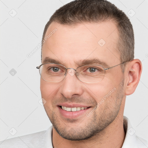 Joyful white adult male with short  brown hair and brown eyes