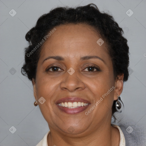 Joyful latino adult female with short  brown hair and brown eyes