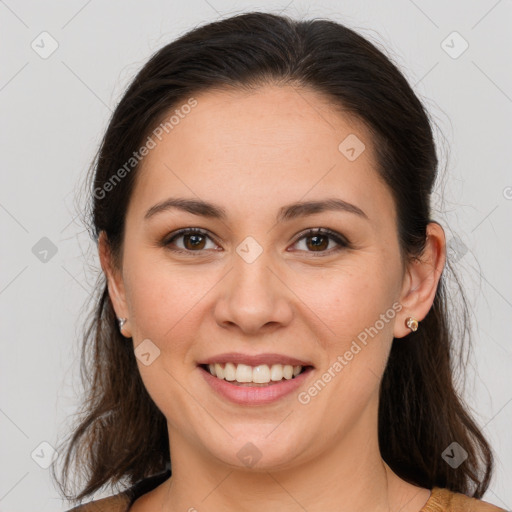 Joyful white young-adult female with medium  brown hair and brown eyes