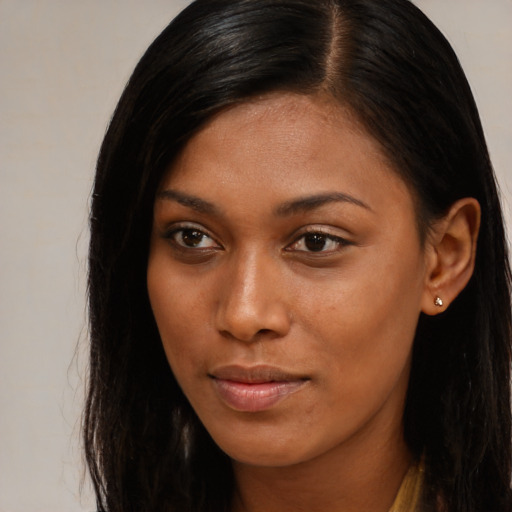 Neutral black young-adult female with long  brown hair and brown eyes