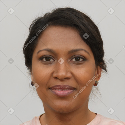 Joyful black adult female with short  brown hair and brown eyes