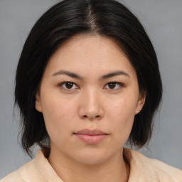 Neutral asian young-adult female with medium  brown hair and brown eyes