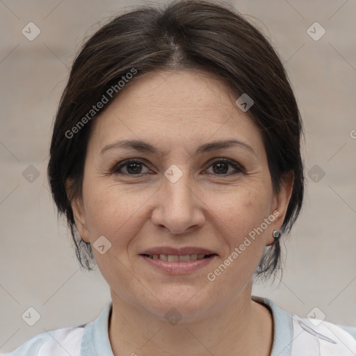 Joyful white adult female with medium  brown hair and brown eyes