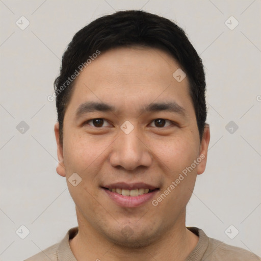 Joyful latino young-adult male with short  black hair and brown eyes