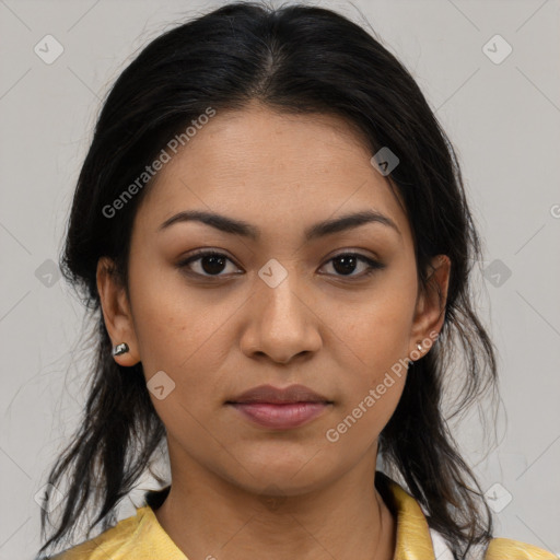 Joyful latino young-adult female with medium  brown hair and brown eyes