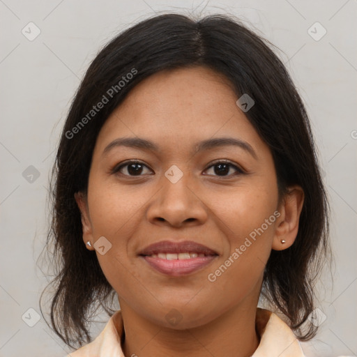 Joyful latino young-adult female with medium  brown hair and brown eyes