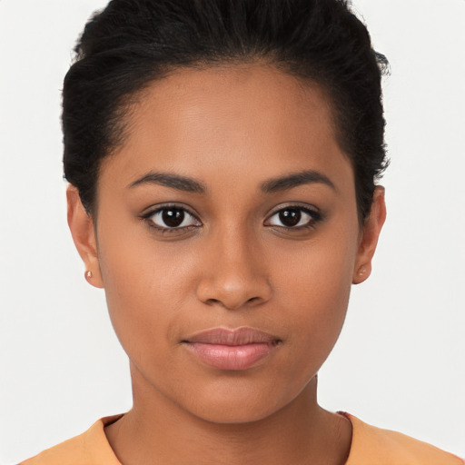 Joyful latino young-adult female with short  brown hair and brown eyes