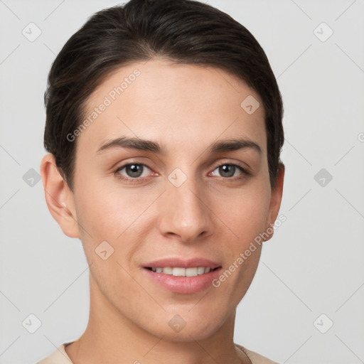 Joyful white young-adult female with short  brown hair and brown eyes