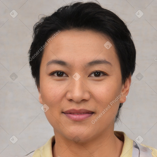 Joyful asian young-adult female with short  black hair and brown eyes