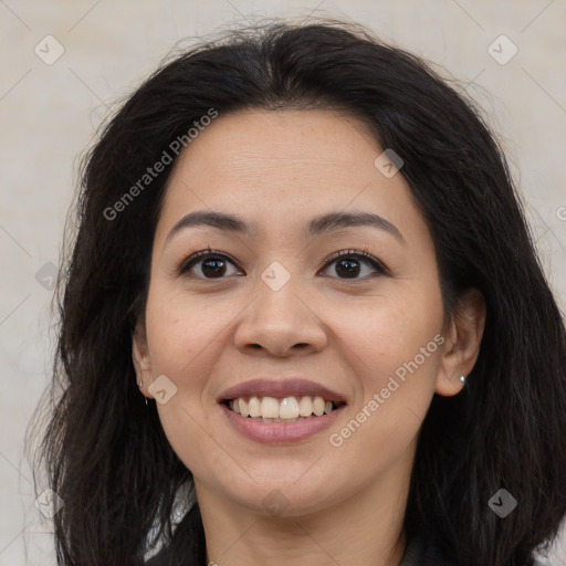 Joyful latino young-adult female with long  brown hair and brown eyes