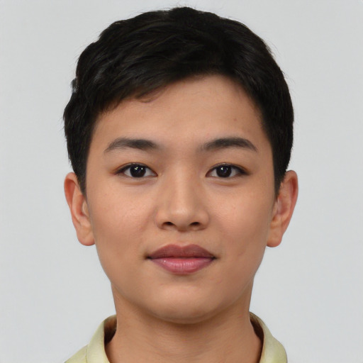 Joyful asian young-adult female with short  black hair and brown eyes