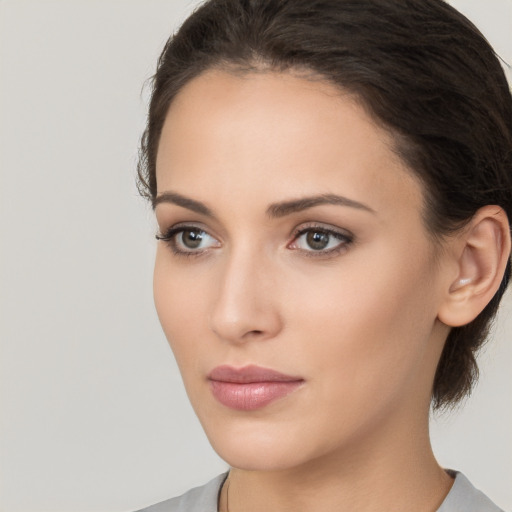 Neutral white young-adult female with medium  brown hair and brown eyes