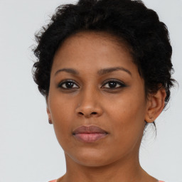 Neutral black young-adult female with short  brown hair and brown eyes