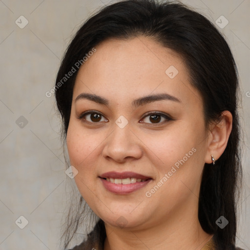 Joyful latino young-adult female with long  brown hair and brown eyes