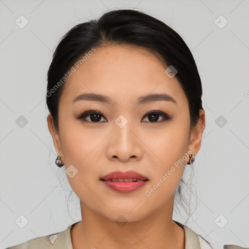 Joyful asian young-adult female with medium  black hair and brown eyes