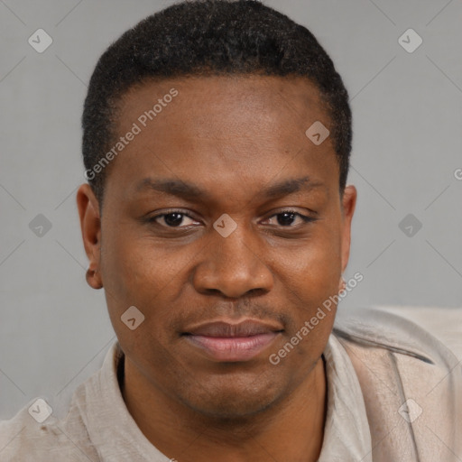 Joyful black young-adult male with short  brown hair and brown eyes