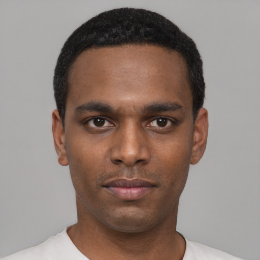 Neutral black young-adult male with short  black hair and brown eyes
