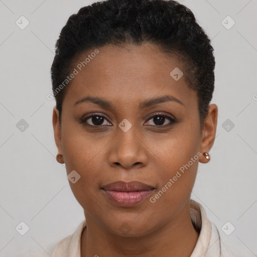 Joyful black young-adult female with short  brown hair and brown eyes