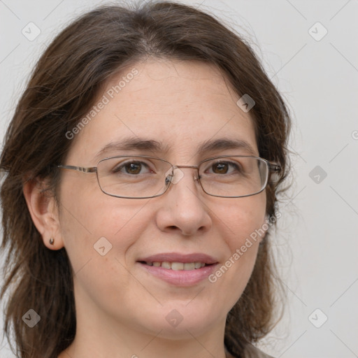 Joyful white adult female with medium  brown hair and grey eyes