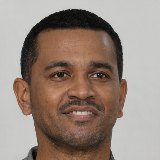 Neutral black young-adult male with short  black hair and brown eyes