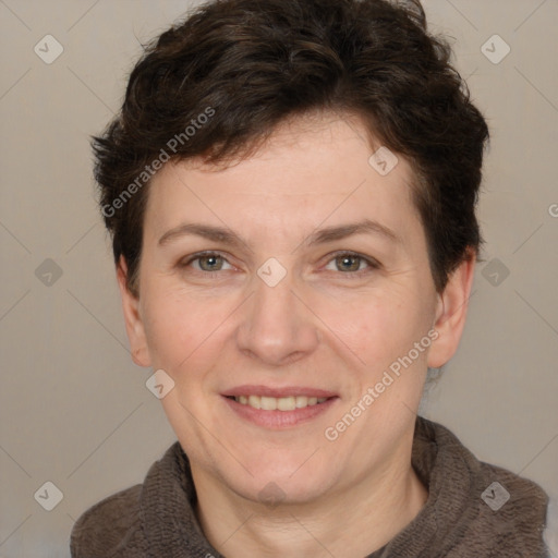 Joyful white adult female with short  brown hair and brown eyes