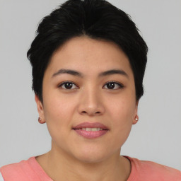 Joyful asian young-adult female with short  black hair and brown eyes