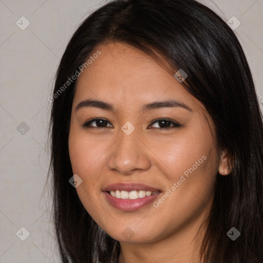 Joyful latino young-adult female with long  brown hair and brown eyes