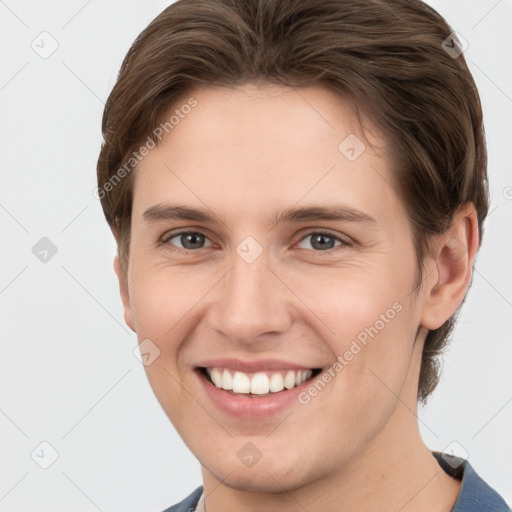 Joyful white young-adult female with short  brown hair and grey eyes