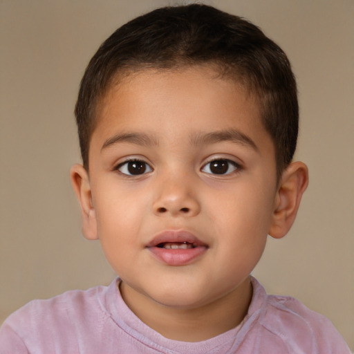 Joyful white child male with short  brown hair and brown eyes